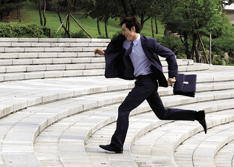 busy businessman dental patient running to appointment