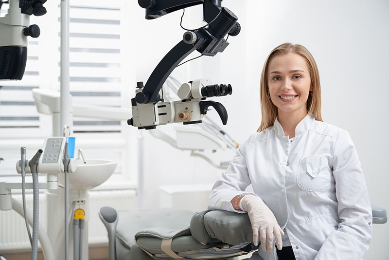Charming Woman Working As Stomatologist, Posing At Dental Office
